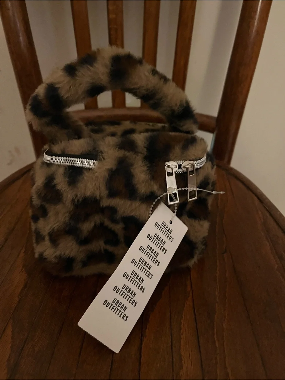 Urban Outfitters plush leopard cosmetic bag